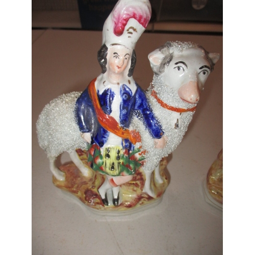 227 - A pair of 19th Century Staffordshire mantle figures of shepherd and sheep. Age related marks