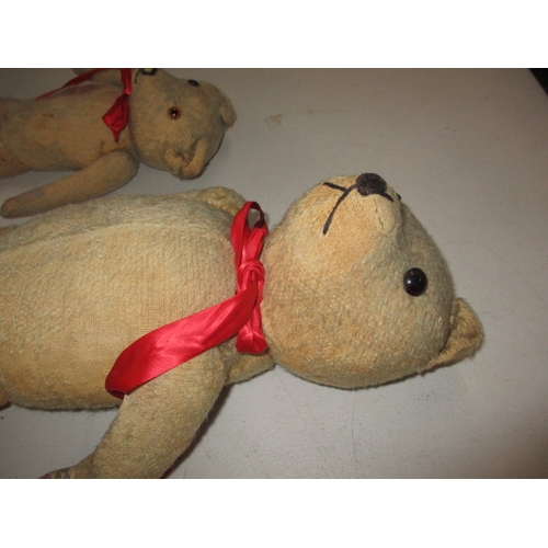 228 - 2 vintage plush teddy bears. Approximate length of largest 58cm. In well used condition