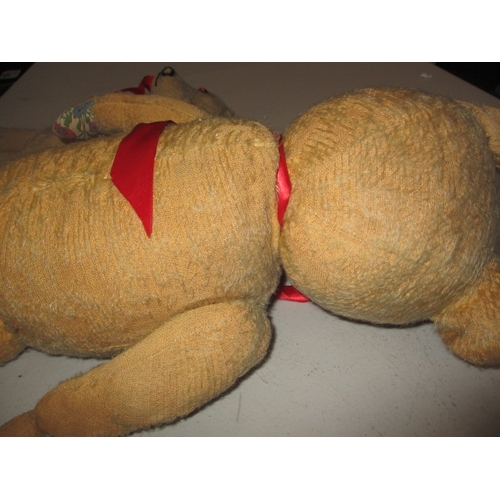 228 - 2 vintage plush teddy bears. Approximate length of largest 58cm. In well used condition