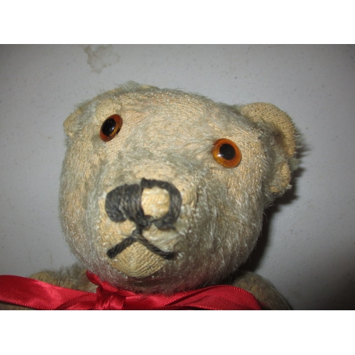 228 - 2 vintage plush teddy bears. Approximate length of largest 58cm. In well used condition