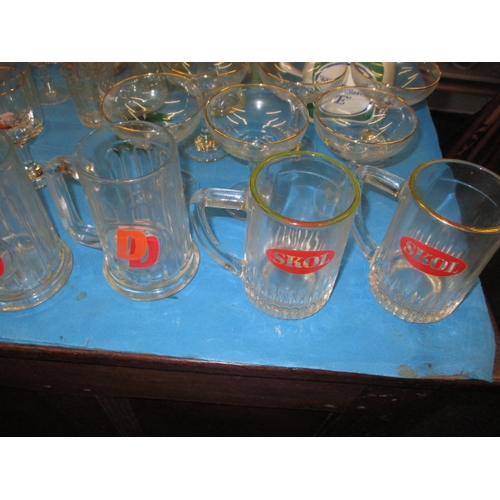 230 - A parcel of vintage barware’s , to include Double Diamond and Skol tankards, all in used condition