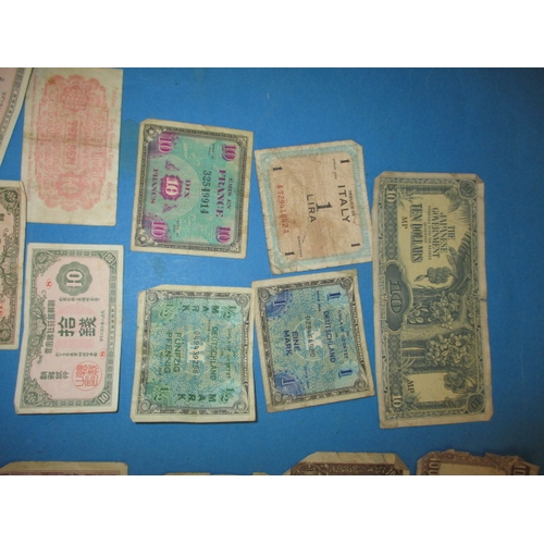 240 - A parcel of vintage world bank notes, to include WWII era invasion notes, all in well circulated con... 