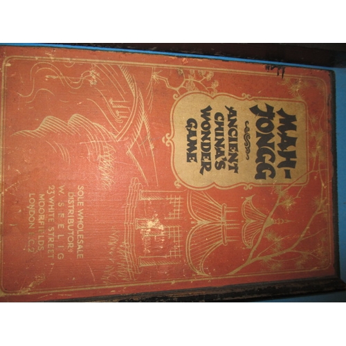 244 - A vintage Mah-Jong set in box, tiles are slate with lithographic images, in used condition and belie... 