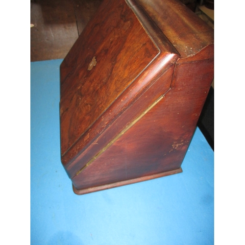 249 - A Edwardian book matched walnut stationary box, with perpetual calendar, no key or ink bottles and g... 