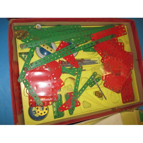 257 - A 1960’s Meccano box with part contents. In well used condition