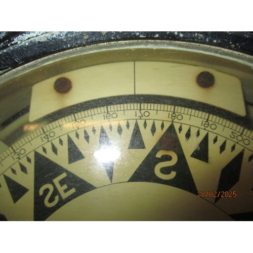258 - A large gimble ships compass on heavy wood stand. Approximate diameter 29cm In pre-owned condition