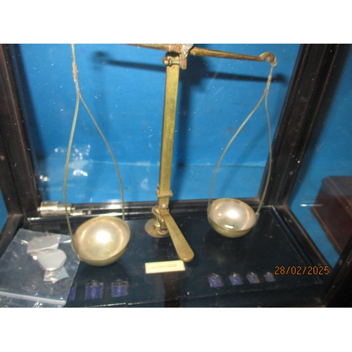 259 - Two sets of laboratory scales, one in glazed case. Both with part sets of weights. In used condition