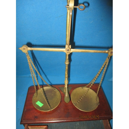 259 - Two sets of laboratory scales, one in glazed case. Both with part sets of weights. In used condition