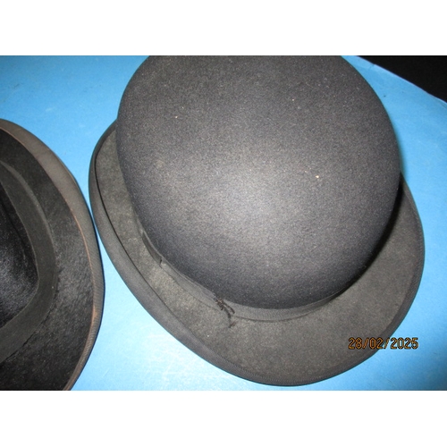 261 - Three vintage hats, two bowlers and one top hat. Various makers and sizes, all in used condition