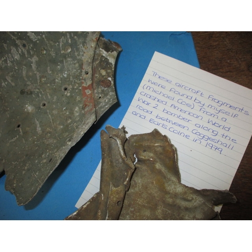 267 - A parcel of interesting military related miscellanea, to include aircraft fragments, silver compact ... 