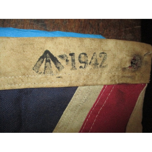 269 - A vintage union jack flag, the edge marked with crows foot and date of 1942, approx. size 92x59cm, h... 