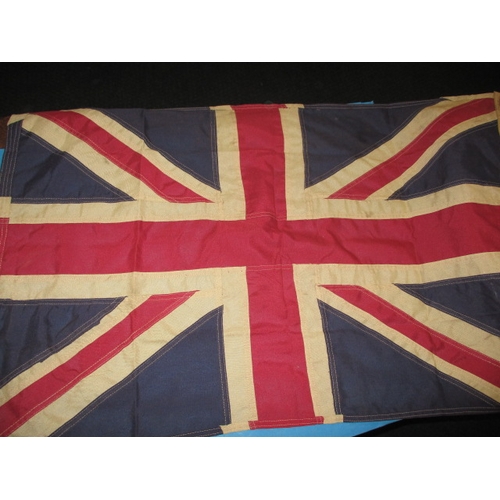 269 - A vintage union jack flag, the edge marked with crows foot and date of 1942, approx. size 92x59cm, h... 