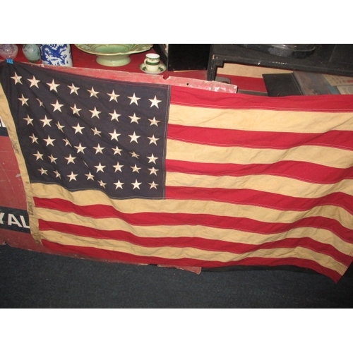 270 - A vintage USA Stars and stripes flag, the edge marked USN and dated1944, approx. size 146x82cm, havi... 