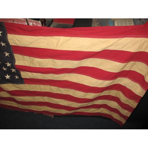 270 - A vintage USA Stars and stripes flag, the edge marked USN and dated1944, approx. size 146x82cm, havi... 