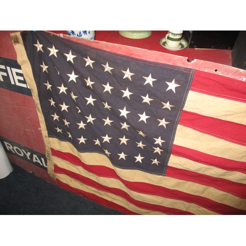 270 - A vintage USA Stars and stripes flag, the edge marked USN and dated1944, approx. size 146x82cm, havi... 