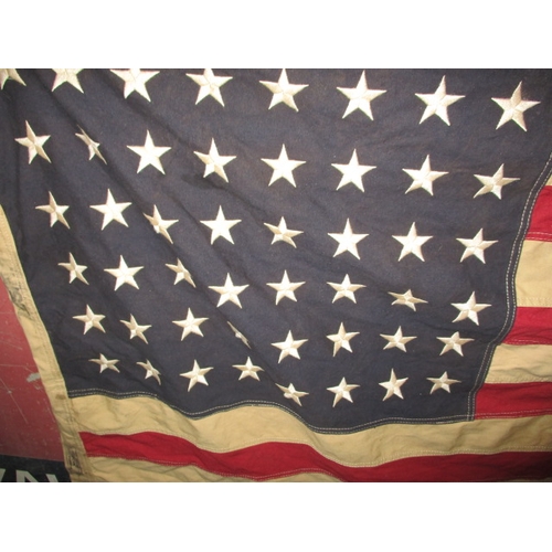 270 - A vintage USA Stars and stripes flag, the edge marked USN and dated1944, approx. size 146x82cm, havi... 