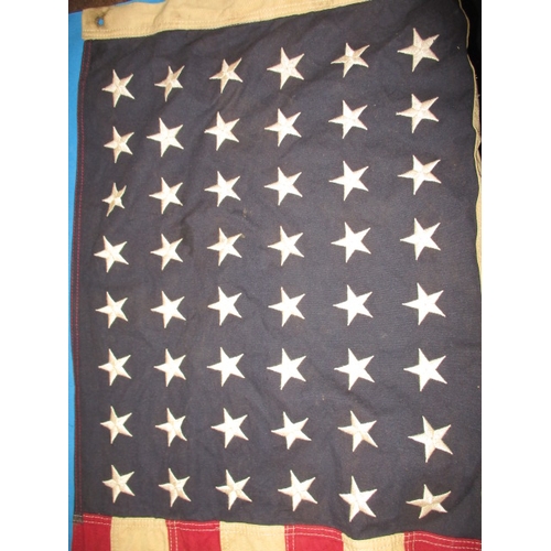 270 - A vintage USA Stars and stripes flag, the edge marked USN and dated1944, approx. size 146x82cm, havi... 