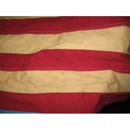 270 - A vintage USA Stars and stripes flag, the edge marked USN and dated1944, approx. size 146x82cm, havi... 