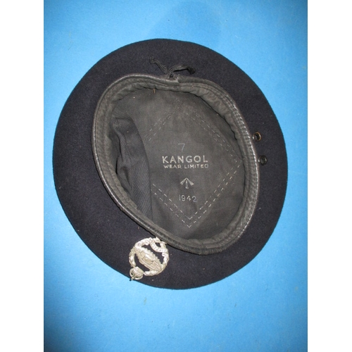 273 - A WWII Kangol beret dated 1942 with armoured unit badge, in used condition