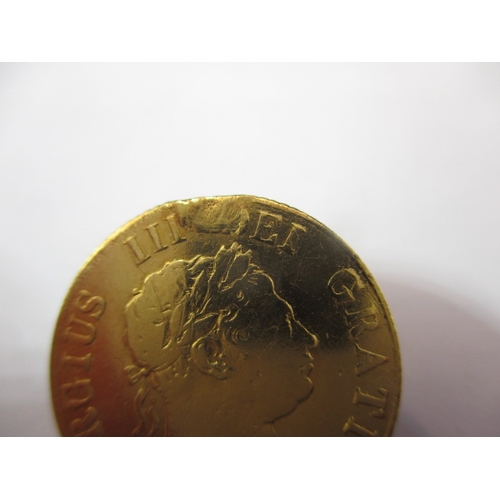 194 - A George III gold half sovereign, dated 1817, a circulated coin with fine definition of features, ni... 