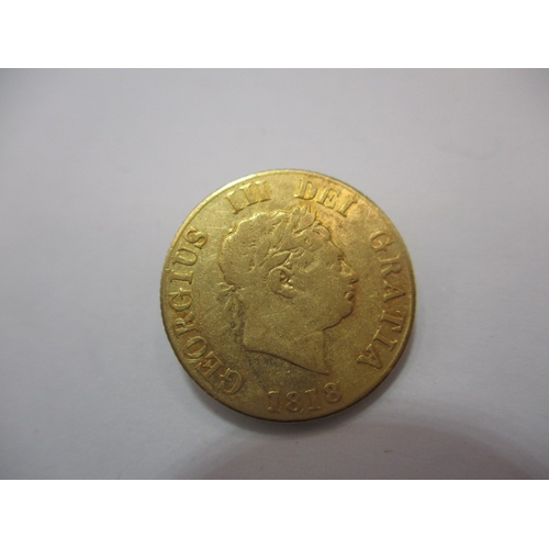 195 - A George III gold half sovereign, dated 1818, a circulated coin with fine definition of features