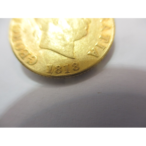195 - A George III gold half sovereign, dated 1818, a circulated coin with fine definition of features