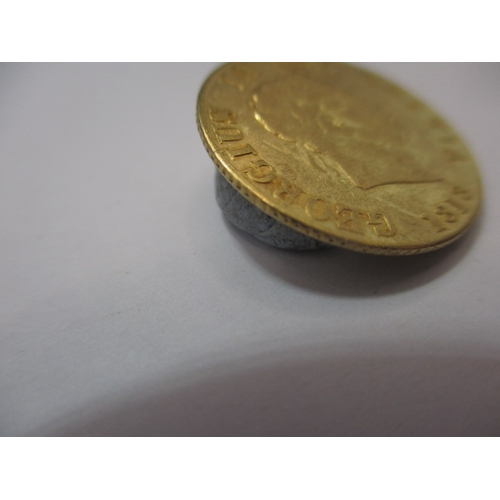 195 - A George III gold half sovereign, dated 1818, a circulated coin with fine definition of features