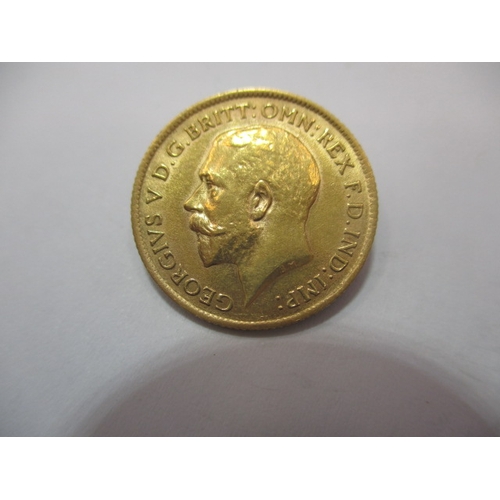 A George V gold half sovereign dated 1911, a circulated coin with fine definition of features