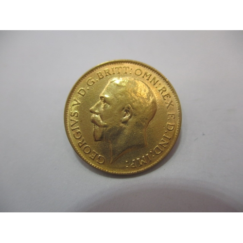 A George V gold half sovereign dated 1915, a circulated coin with fine definition of features
