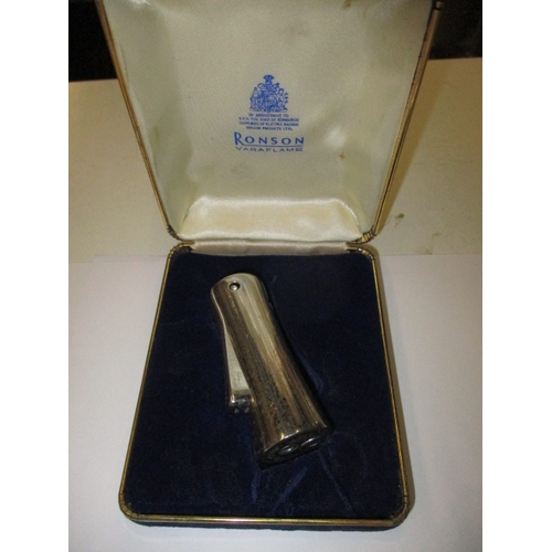 A mid-century Ronson cigarette lighter in working order with original box
