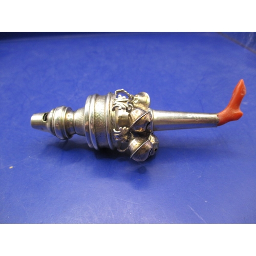 A sterling silver baby rattle with coral teething piece and all the bells and whistles. Approx weight 44.7g