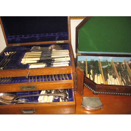 Two canteens of assorted cutlery and a silver box, in used pre-owned condition. Approx. weight of silver box 56g