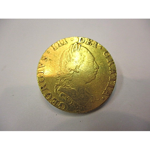 A George III shield back half guinea dated 1786, A circulated coin with ...