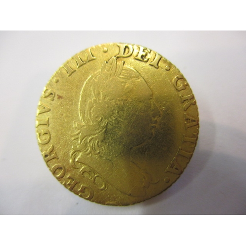 A George III shield back half guinea dated 1786, A circulated coin with ...