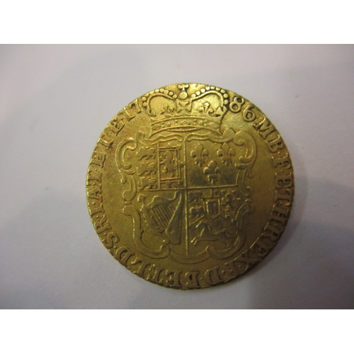 A George III shield back half guinea dated 1786, A circulated coin with ...
