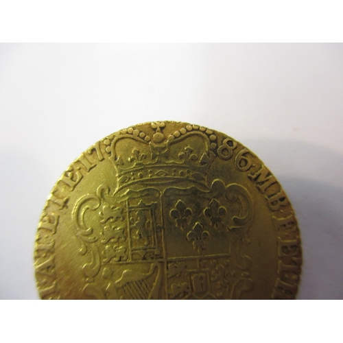 A George III shield back half guinea dated 1786, A circulated coin with ...