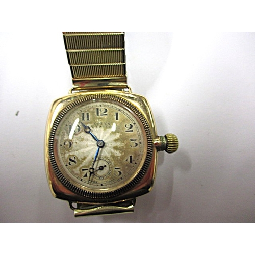 162 - A c1930s Rolex Oyster gold cased cushion wrist watch with later expanding bracelet, runs well when w... 