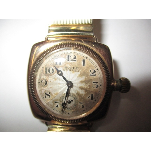 162 - A c1930s Rolex Oyster gold cased cushion wrist watch with later expanding bracelet, runs well when w... 