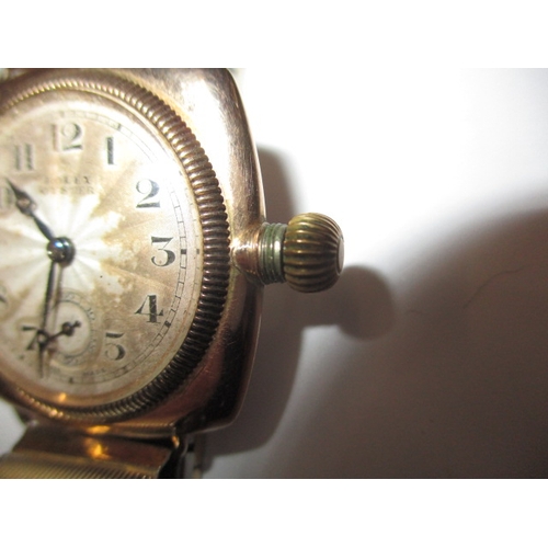 162 - A c1930s Rolex Oyster gold cased cushion wrist watch with later expanding bracelet, runs well when w... 