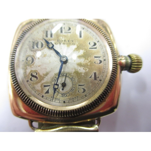 162 - A c1930s Rolex Oyster gold cased cushion wrist watch with later expanding bracelet, runs well when w... 