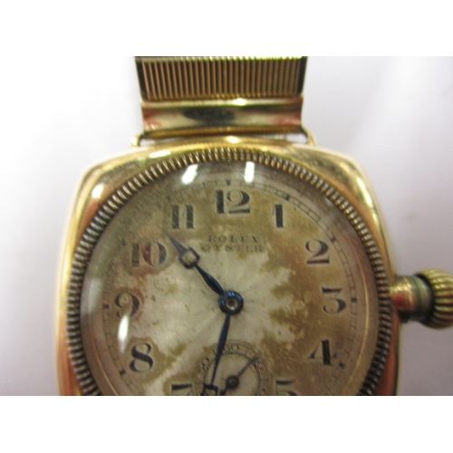 162 - A c1930s Rolex Oyster gold cased cushion wrist watch with later expanding bracelet, runs well when w... 