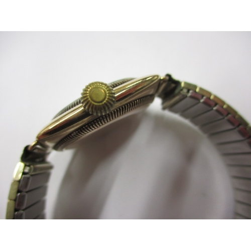 162 - A c1930s Rolex Oyster gold cased cushion wrist watch with later expanding bracelet, runs well when w... 