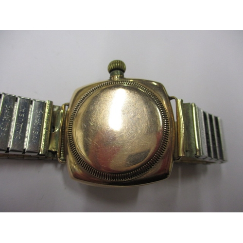 162 - A c1930s Rolex Oyster gold cased cushion wrist watch with later expanding bracelet, runs well when w... 