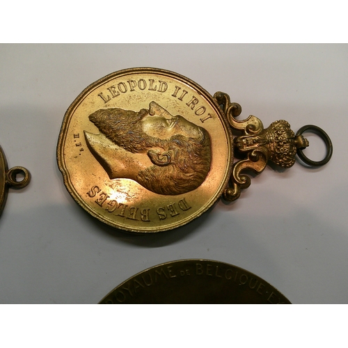 275 - Four antique and later Belgian bronze medallion awards, to include the 1910 Exposition, all in used ... 