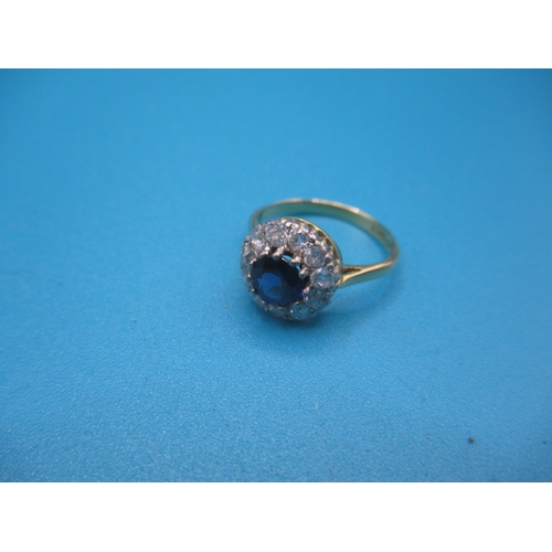 41 - An 18ct yellow gold and platinum  diamond and sapphire daisy ring, approx ring size ‘K+’, approx wei... 