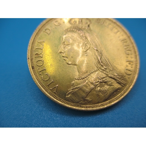 251 - A Victorian gold double sovereign dated 1887, a circulated coin with very fine definition of feature... 