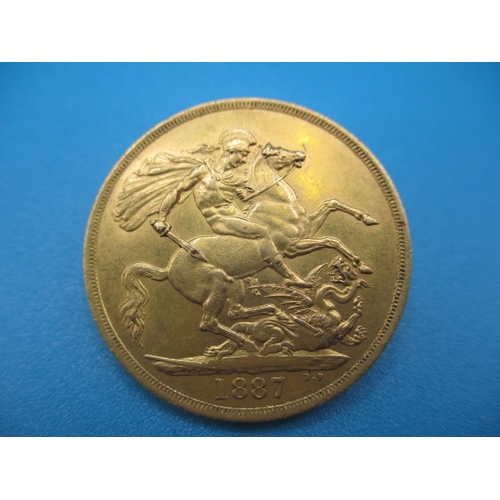 251 - A Victorian gold double sovereign dated 1887, a circulated coin with very fine definition of feature... 