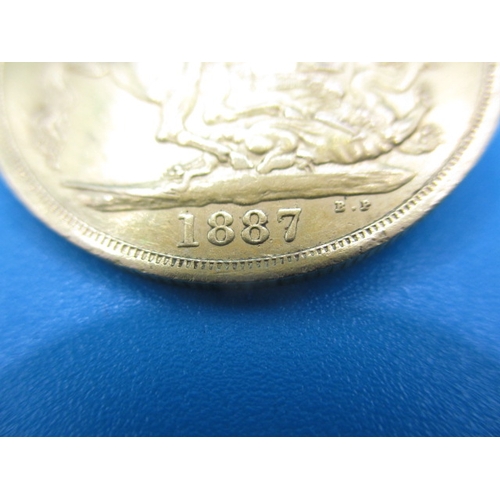 251 - A Victorian gold double sovereign dated 1887, a circulated coin with very fine definition of feature... 