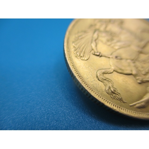 251 - A Victorian gold double sovereign dated 1887, a circulated coin with very fine definition of feature... 