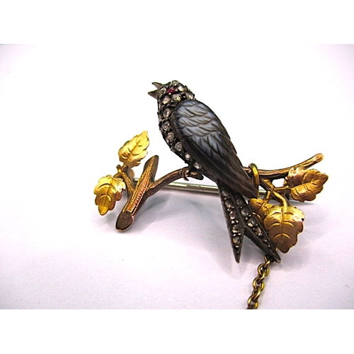 145 - An antique brooch of a song bird on a branch, yellow metal and gem set, electronically tested as dia... 